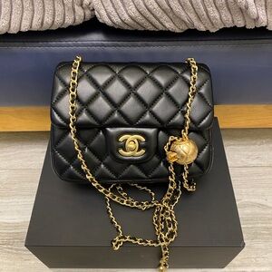 CHANEL Black Quilted Lambskin Shoulder Bag with Gold Chain and CC Lock